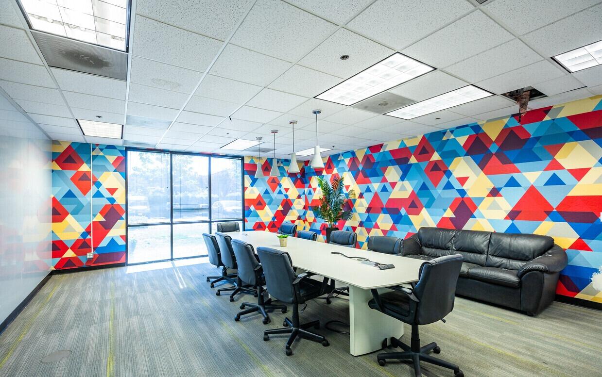 A conference room with colorful walls and chairs in Santa Clara, CA