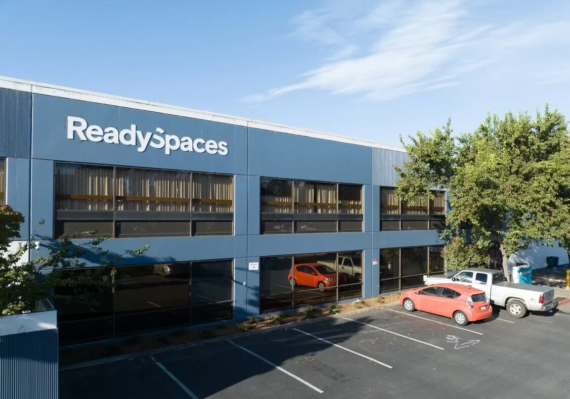 A hayward warehouse space building with a sign that says readyspaces.