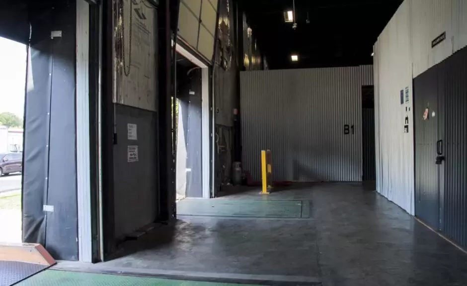 The entrance to a storage facility with a door.
