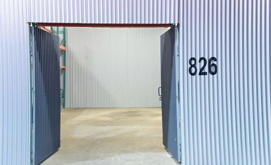 A warehouse with a door that has a number on it.
