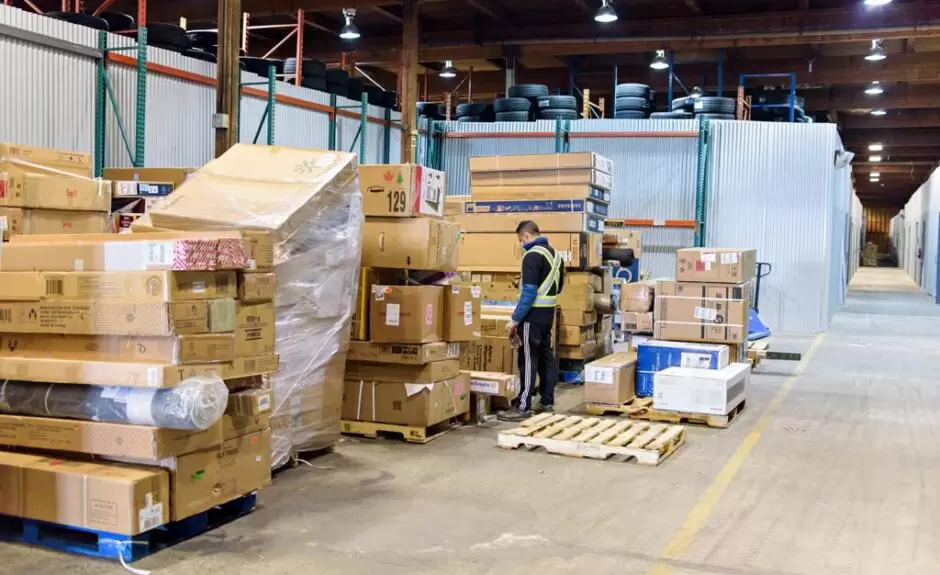 A warehouse full of boxes and pallets.